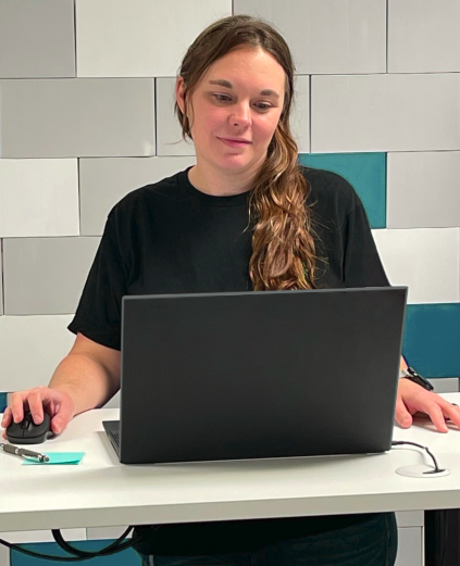 Business filing expert working at a computer.